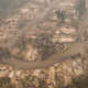 In this aerial view from a drone, damaged homes are seen in a mobile home park on September 11, 2020 in Ashland, Oregon. Hundreds of homes in Ashland and nearby towns have been lost due to wildfires.